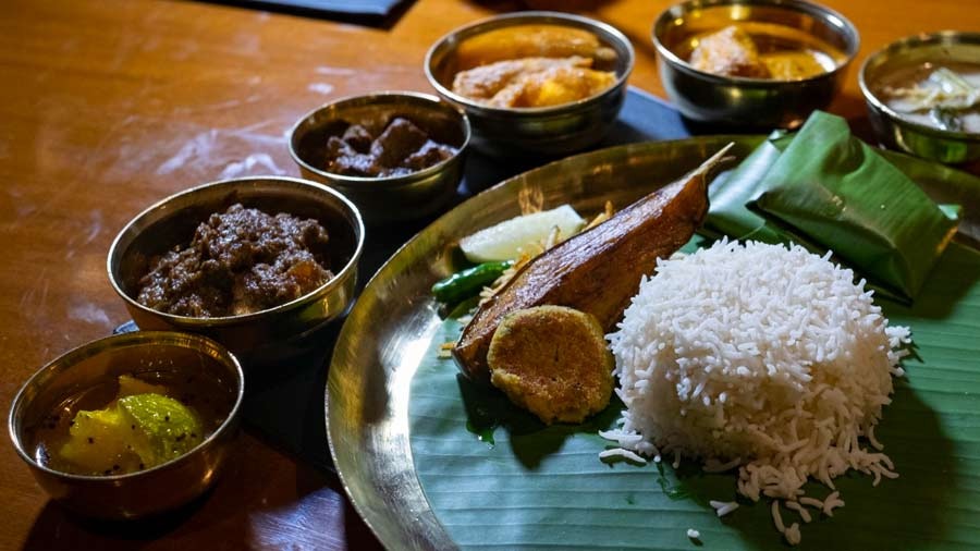 The thali has everything from begun bhaja and aam postor bora to bhetki maacher paturi and kosha mangsho