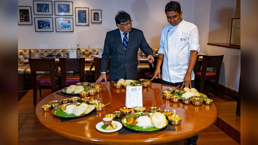 Ghosh and Kingshuk Kundu, brand chef of Oh! Calcutta and other Speciality brands, inspect their offerings