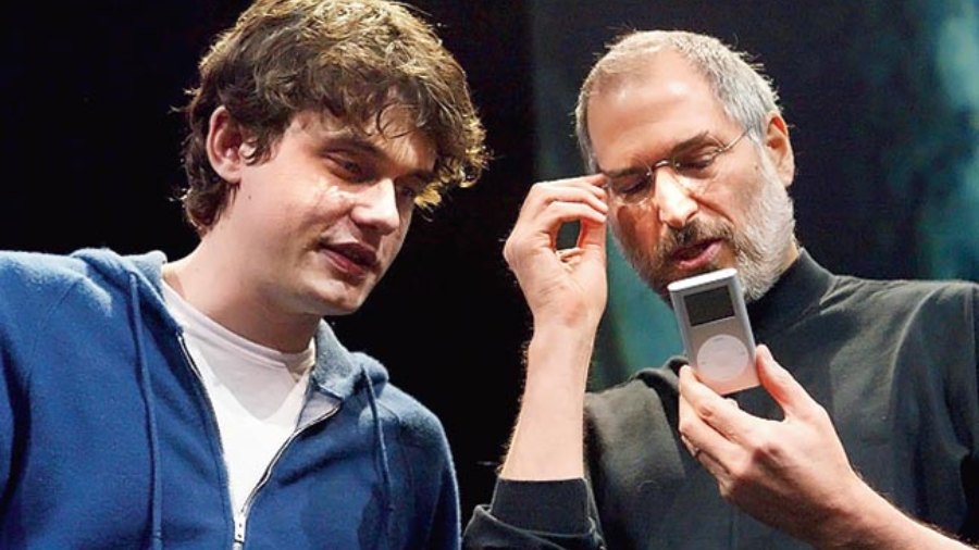 The first iPod arrived in 2001, changing the way music is heard and distributed. Steve Jobs (right) found an iPod enthusiast in singer John Mayer. 