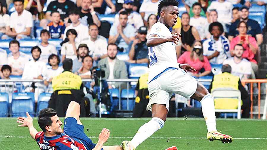 Vinicius Junior (right) scores Real Madrid’s sixth goal to complete his hat-trick on Thursday. 