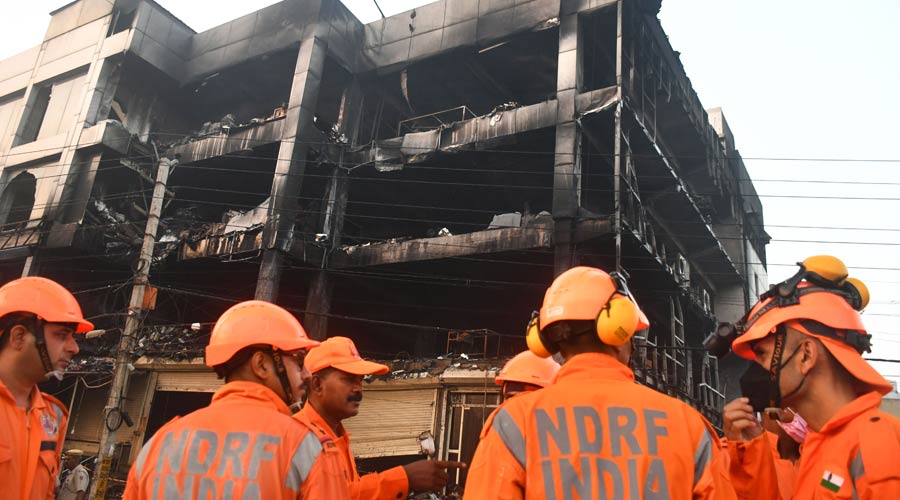 NDRF personnel during rescue and relief work after a massive fire at the office building 