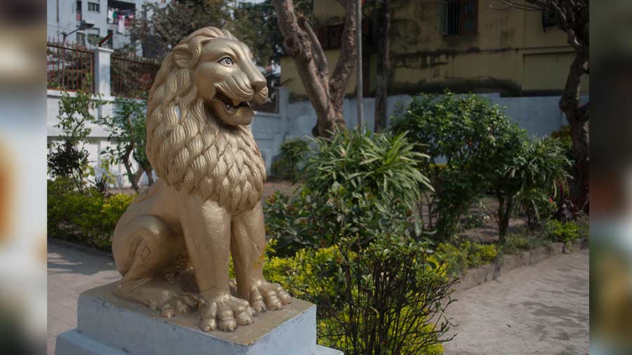 The temple’s entrance is flanked by a lion 