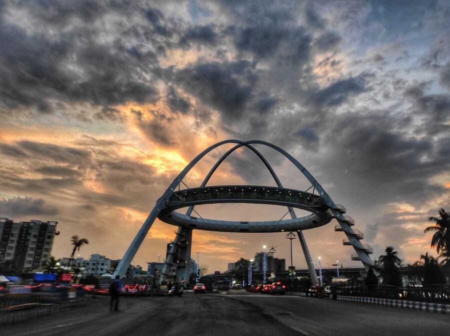 PICTURE PERFECT: The sky presents a brilliant blend of orange and grey hues over the Biswa Bangla Gate on Tuesday, May 10. 