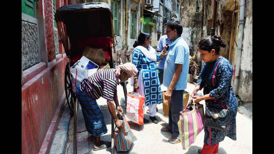 A family packs up their belongings to move out of Durga Pituri Lane in Bowbazar on Saturday. 