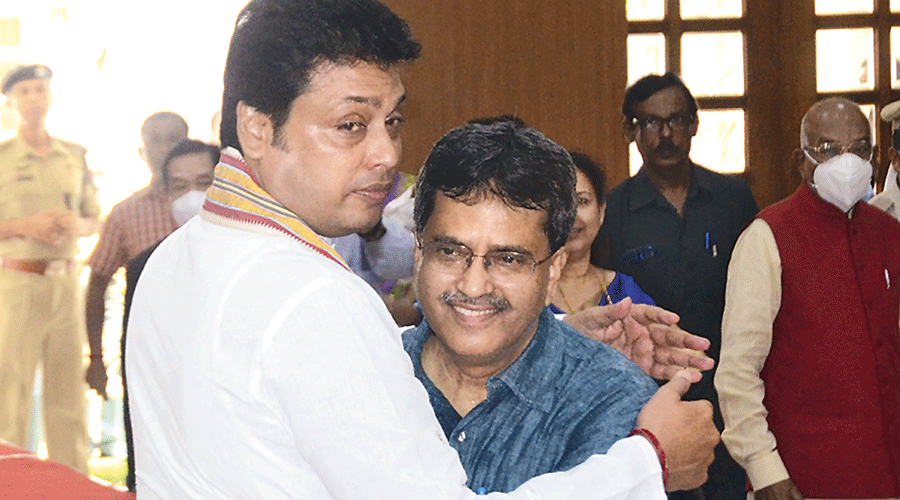 New Tripura chief minister Manik Saha with former chief minister Biplab Kumar Deb (left) after his oath-taking ceremony in Agartala on Sunday.