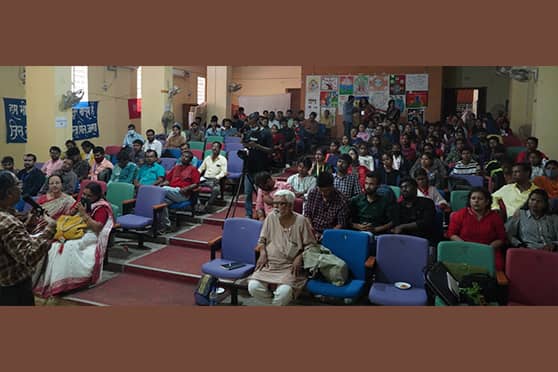 Students and dignitaries watch the film festival at the Ranchi University Auditorium.