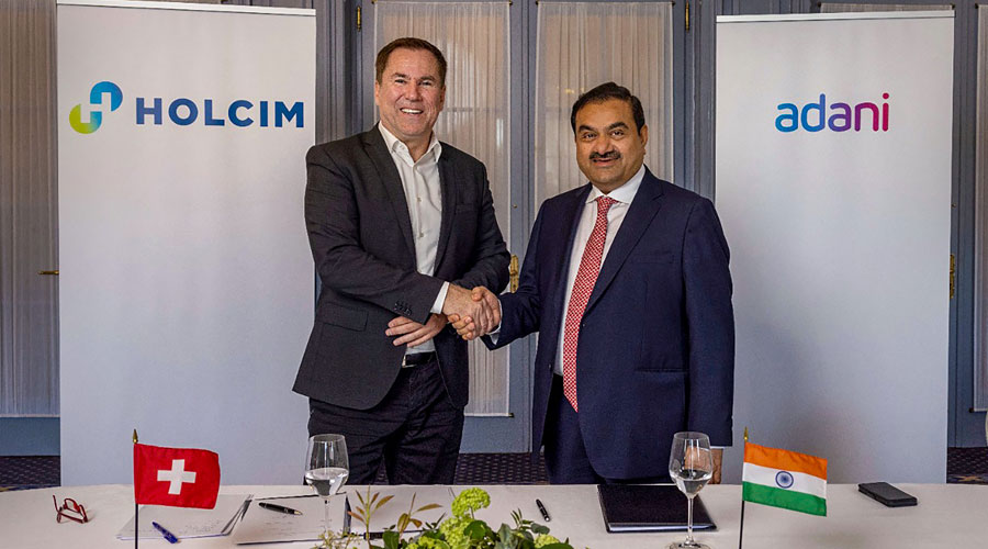 Adani Group Chairman Gautam Adani with Holcim CEO Jan Jenisch. 