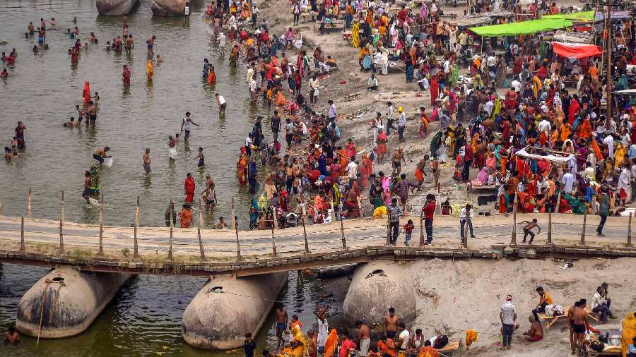 Hindu devotees gather at the banks of river Ganga on the occasion of  Buddha Purnima, at Phaphamau ghat in Prayagraj