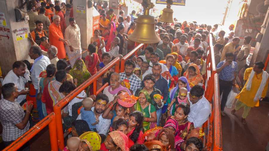 Devotees wait to offer prayers at Vindhyavasini temple, in Mirzapur