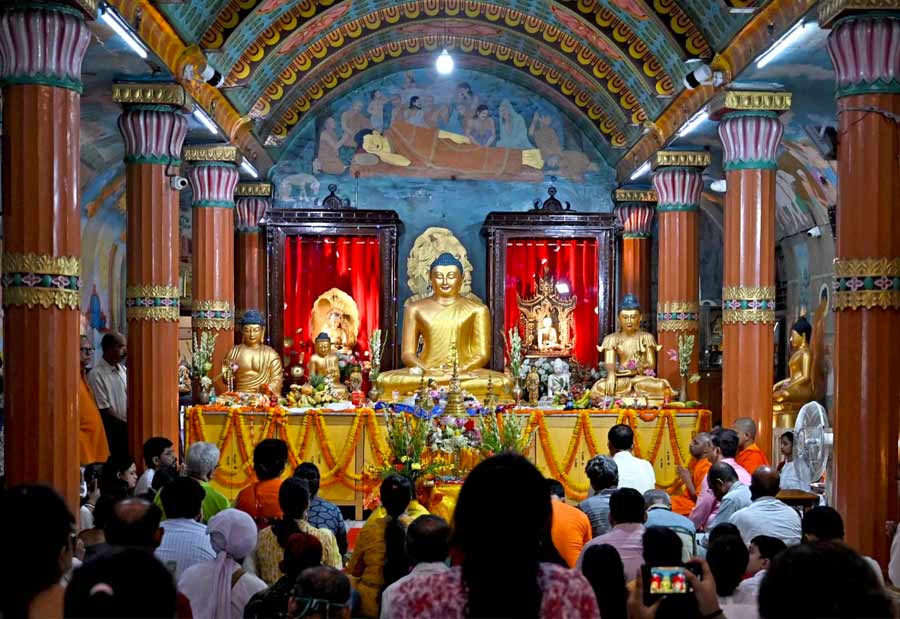 Devotees gather to pray and offer flowers and food to idols of Lord Buddha at the Mahabodhi Society of India headquarters at Bankim Chatterjee Street on Monday. Extending heartiest greetings to all on the occasion of Buddha Purnima, chief minister Mamata Banerjee Monday said the teachings of Buddha should inspire people to follow the path of peace and non-violence.