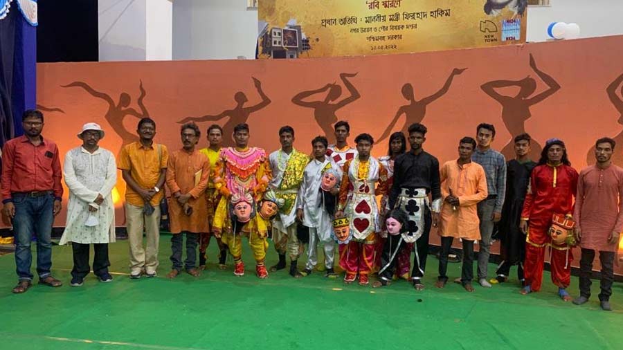 Dancers pose for a group photograph 