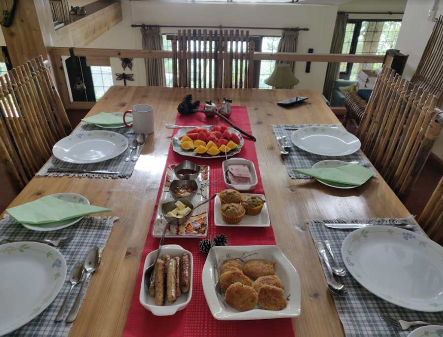 The breakfast spread at Kaleege House - fresh fruits, cereal, ham, sausages, bread, jams and spread and eggs as-you-like-it 