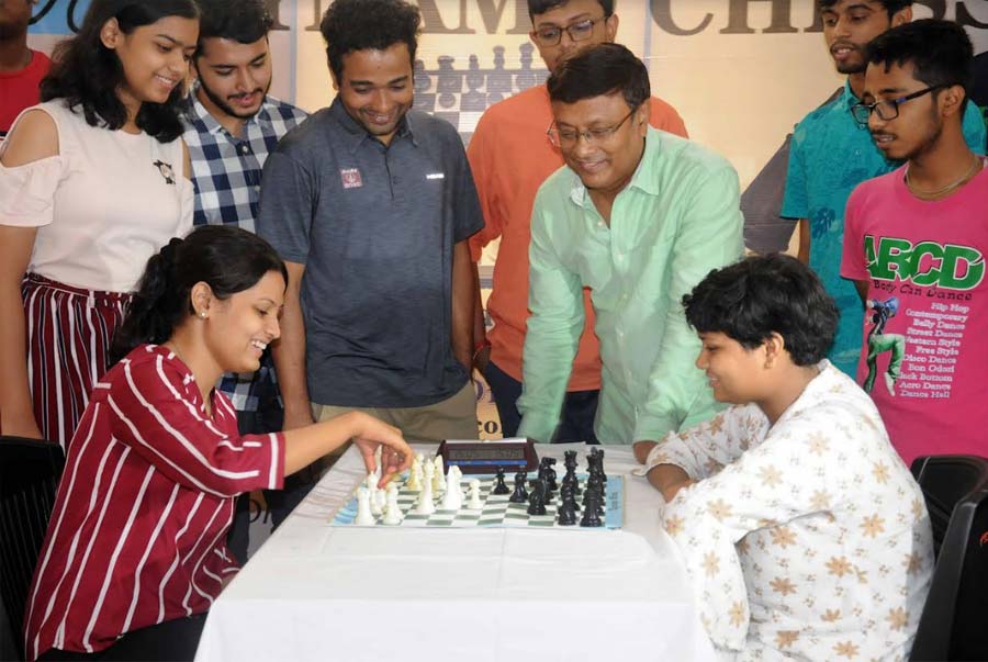 (In mint green shirt) Grandmaster Dibyendu Barua and other adept chess players enjoy a gleeful moment during a chess tournament in the city on Friday