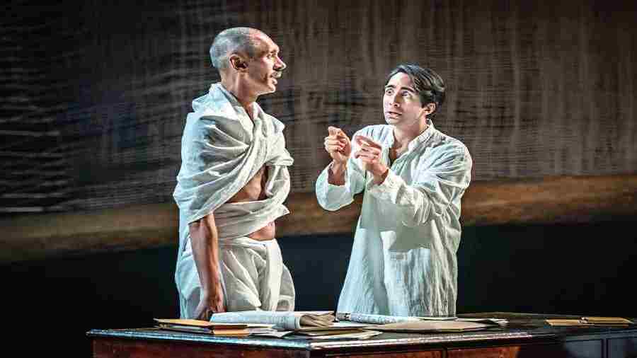 Paul Bazely as Gandhi and Shubham Saraf as Godse in the play The Father and the Assassin at the National Theatre in London. 