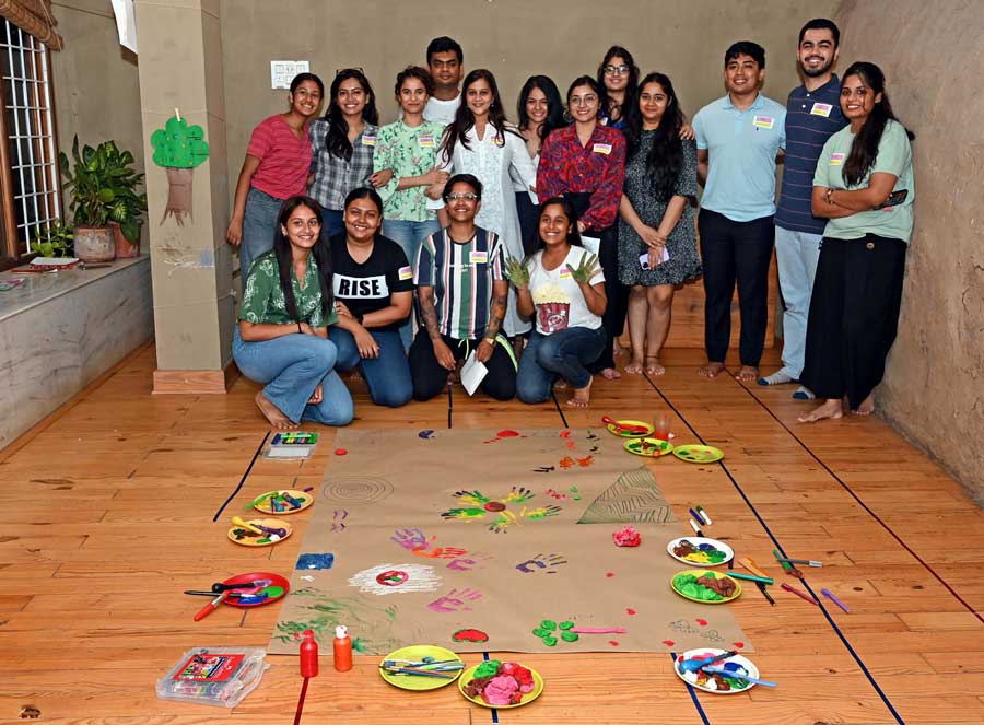 The 15 participants with workshop facilitator Priyanka and the combined art piece