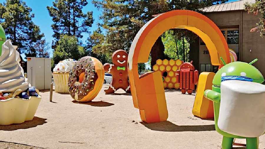 File picture of statues of different Android versions at a Google-themed park