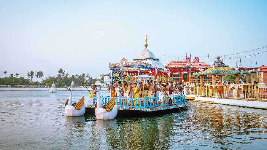The deities on a boat ride on Saturday at Narendra Tank in Puri