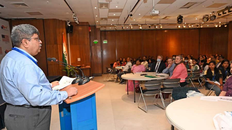 Rishi Kant reads from a statistical report to explain the achievement of the Swayam Siddha project