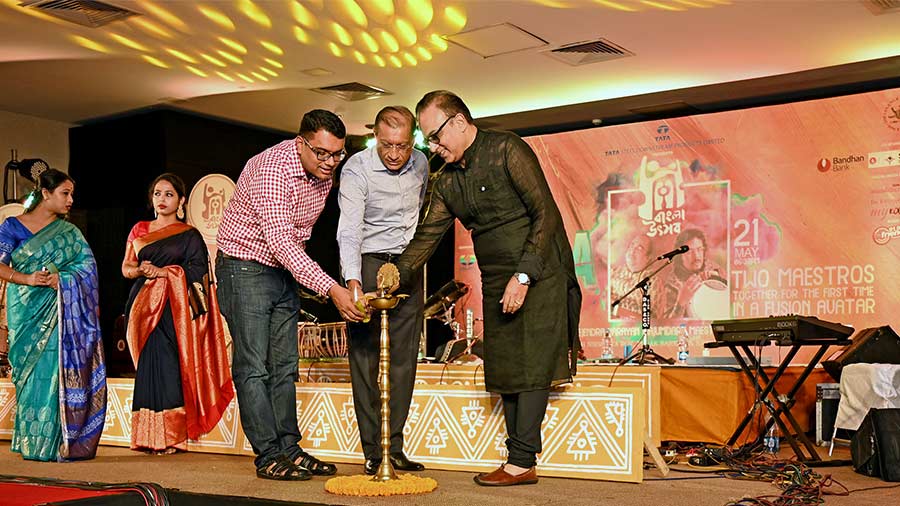 (L-R) The inaugural lamp was lit by BCC&I vice president, Arnab Basu, Tollygunge Club president Joydeep Datta Gupta and Arindam Sil, chairperson, Films, Music and Entertainment Committee, BCC&I