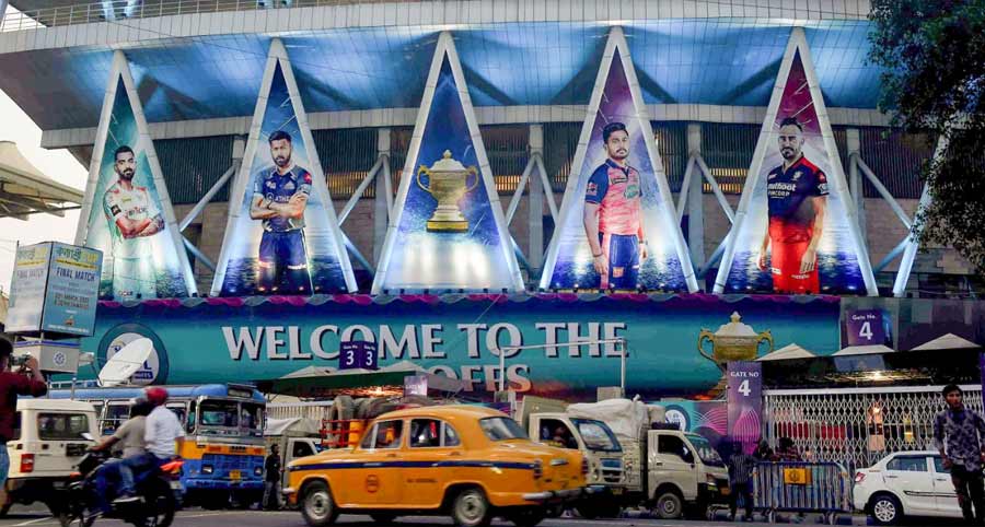 Vehicles move past the Eden Gardens on Monday, the eve of the Indian Premier League 2022 first Qualifier match between the Gujarat Titans and the Rajasthan Royals