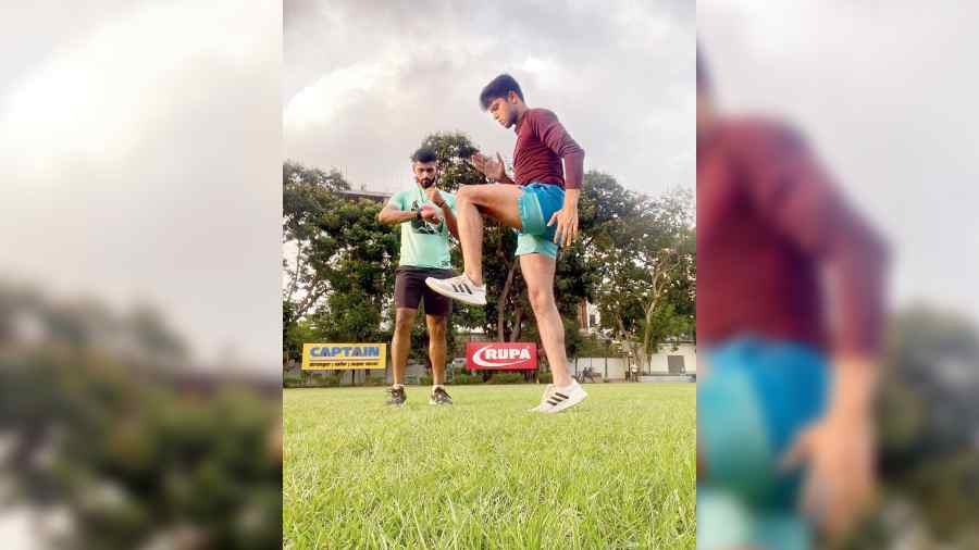 Endorphins running coaches Spandan Dutta and Nawaz Ahmed working on running form