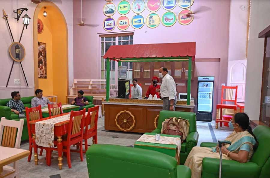 With brightly coloured wooden furniture and leather sofas that can seat up to 34 people at once, the café is themed on the postal heritage of India.