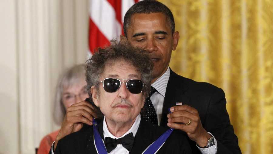 President Barack Obama presents Bob Dylan with the Presidential Medal of Freedom during a ceremony at the White House in Washington on May 29, 2012