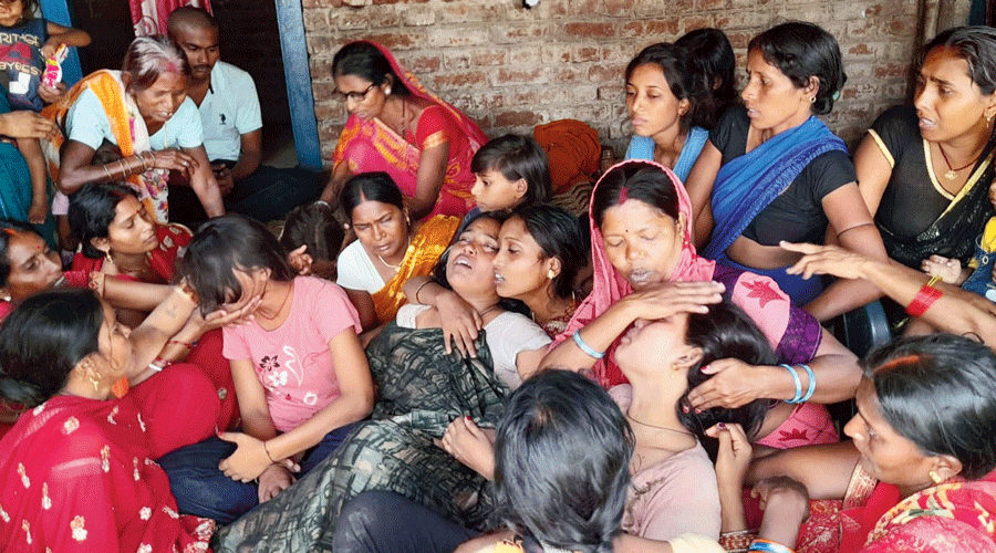 Grieving family members of some of those affected by the hooch incident in Gaya on Tuesday.