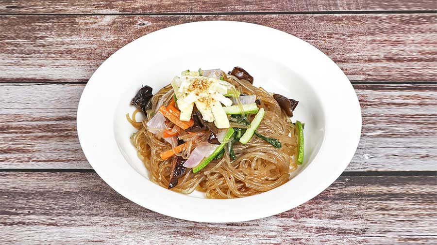 A plate of 'japchae', a savoury stir-fried glass noodle served with veggies