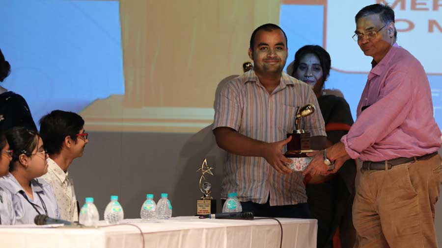 Sankhadeep Shome receiving his award