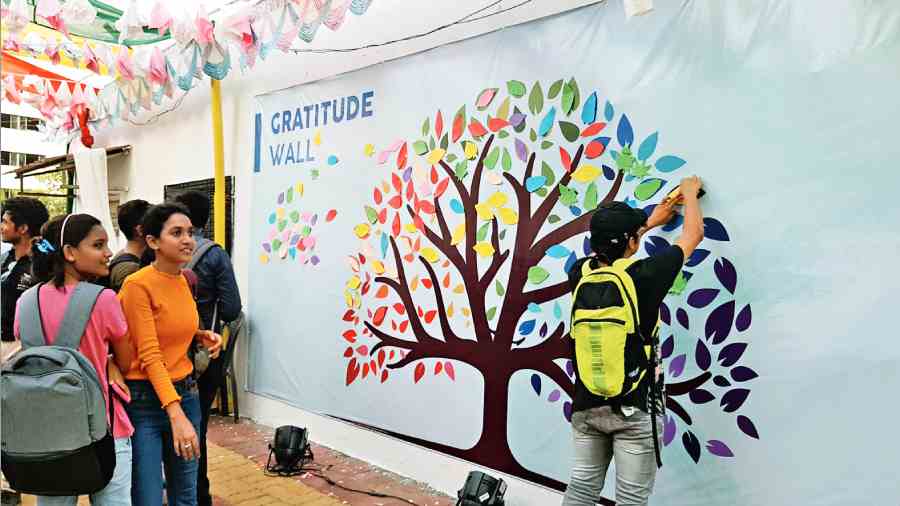 A student pins up a message on the ‘gratitude wall’ at the Techno India campus in  Sector V. 
