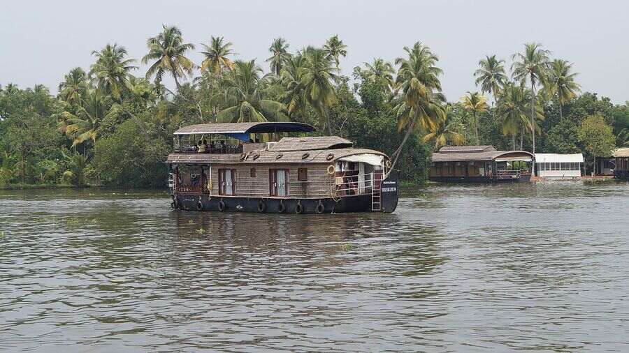 A houseboat sailing on the Alappuzha backwaters in Kerala