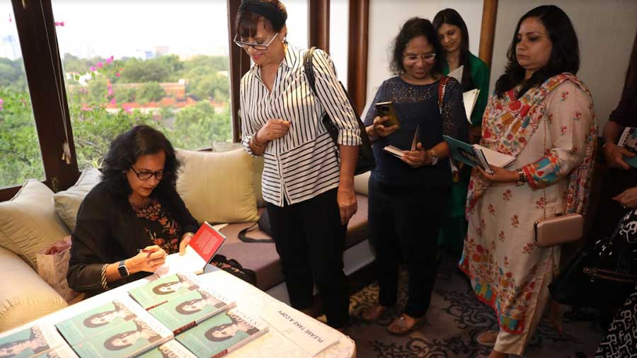 Tharoor Srinivasan signing copies of her book