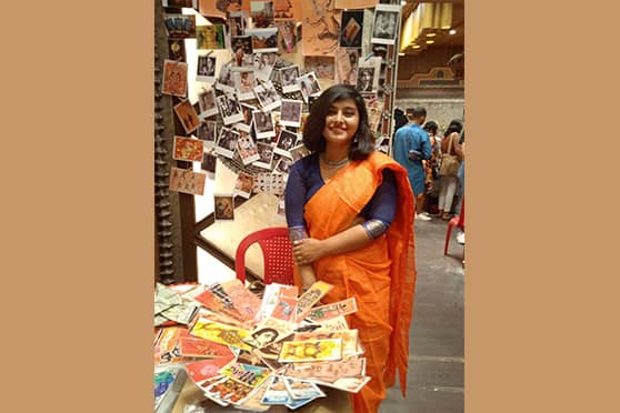 Priyanjali Sen, a third-year English student of Gokhale Memorial Girls’ College, by her stall Imperfections, where she sold bookmarks, Polaroid photographs, postcards, and painted bookmarks. 