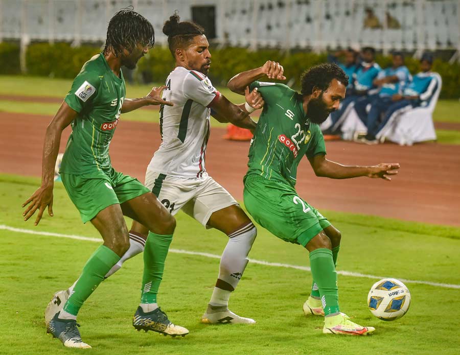 SKILL SHOWCASE: Maziya Sports & Recreation Club defenders try to stop ATK Mohun Bagan FC forward Roy Krishna (in white) during the AFC Cup group stage match at Salt Lake stadium Tuesday, May 24. Maziya Sports and Recreation Club is a Maldivian professional football club. Mohun Bagan brushed aside Maziya Sports with a final score of 5-2