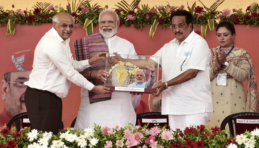 Prime Minister Narendra Modi with Gujarat Chief Minister Bhupendra Patel and State BJP President C.R. Paatil during the inauguration of K.D. Parvadiya multi-speciality hospital, in Atkot on Saturday