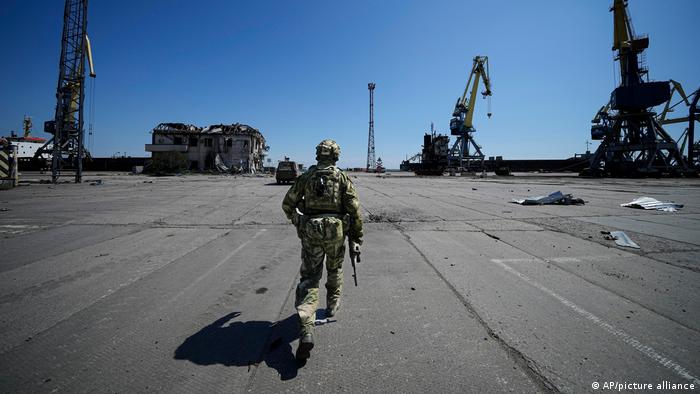 A Russian solider at the empty Ukrainian port of Mariupol, which has stopped exporting food grains.