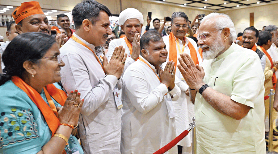 Prime Minister Narendra Modi meets delegates during a conclave on the cooperative sector in Gandhinagar  on Saturday.