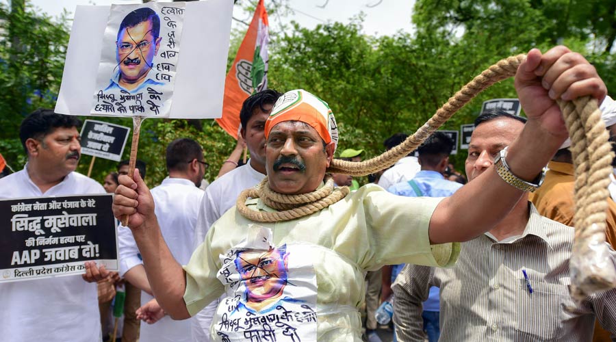 A Congress activist during a protest over killing of Punjabi singer and Congress leader Sidhu Moose Wala, in New Delhi on Monday.