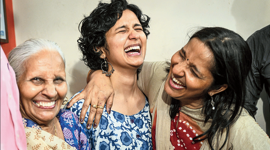 Shruti Sharma with her mother and another family member at her home in New Delhi  on Monday after the UPSC results were announced.
