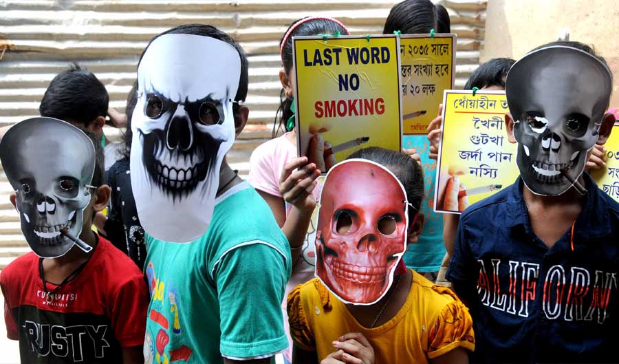 Children take part in a rally to mark World No-Tobacco Day in north Kolkata on Tuesday