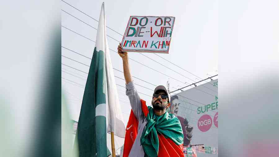 A man holding a poster during the freedom march led by the former prime minister of Pakistan, Imran Khan, Lahore, October 2022