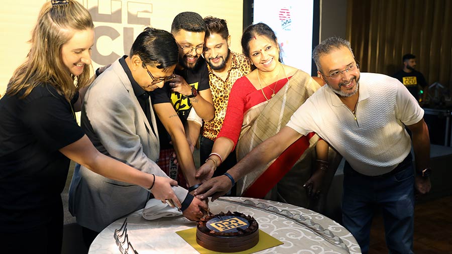 (L-R) Pauline Laravoire, Debasish Sen, Meghdut Roychowdhury, Neel Bhattacharya, Manoshi Roychowdhury and Joydeep Karmakar cut a cake to inaugurate the festival 