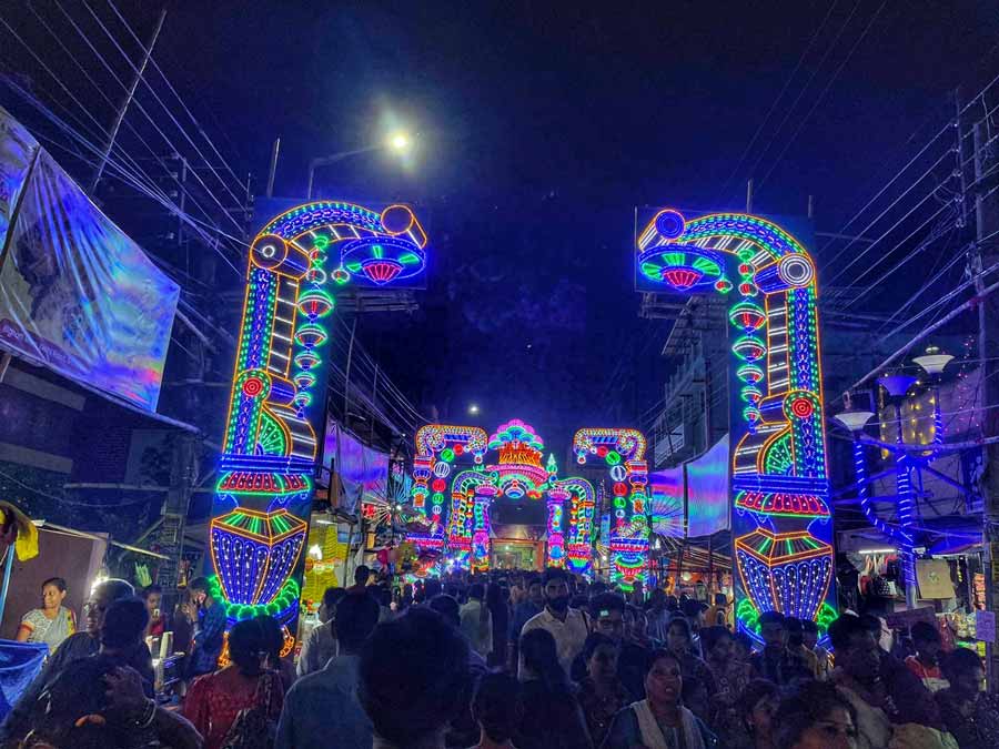 People throng a Jagaddhatri puja pandal illuminated with lights in Chandernagore on Tuesday evening. Jagaddhatri puja this year is being celebrated between October 31 and Nov 3, 2002