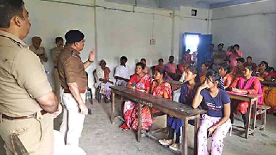 A police officer speaks on cyber crime at a Duare Sarkar camp in Alipurduar district on Wednesday. 