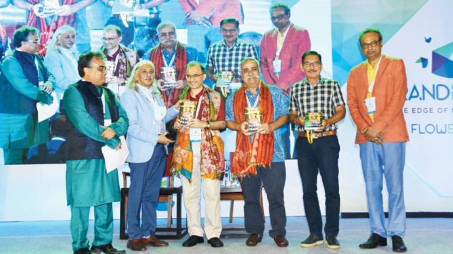 Harish Bhat, Piyush Pandey, Arun Lal and Soumyajit Mahapatra with a copy of Open House