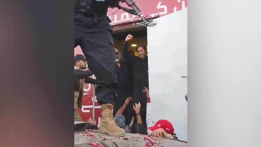 Imran waves at his supporters