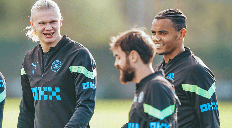 In an image posted by Manchester City on Twitter, Erling Haaland (left) shares a light moment with teammates during a practice session on Friday.