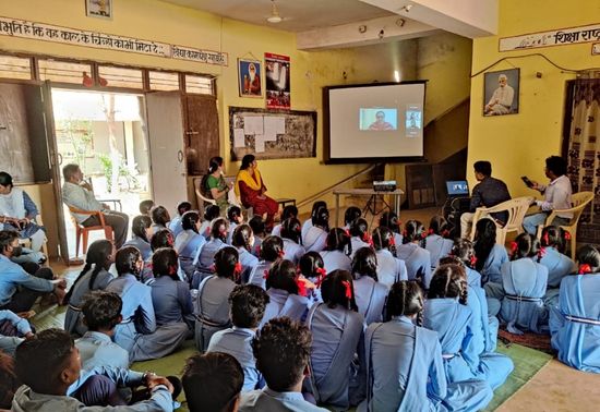 Students in Govt. schools in Bastar, Chhattisgarh listening to an Amazon Volunteer speak about their career journeys