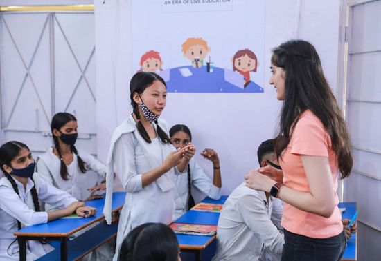 Amazon Volunteer at a school in Gurgaon talking to children about coding and tech careers